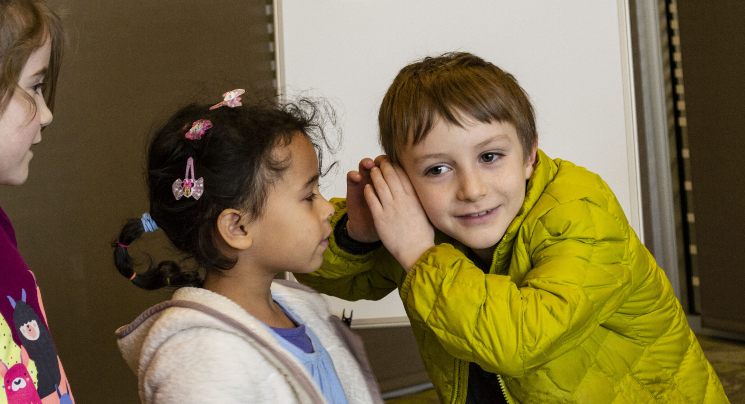 Children playing an educational game while learning the Steps to Democracy