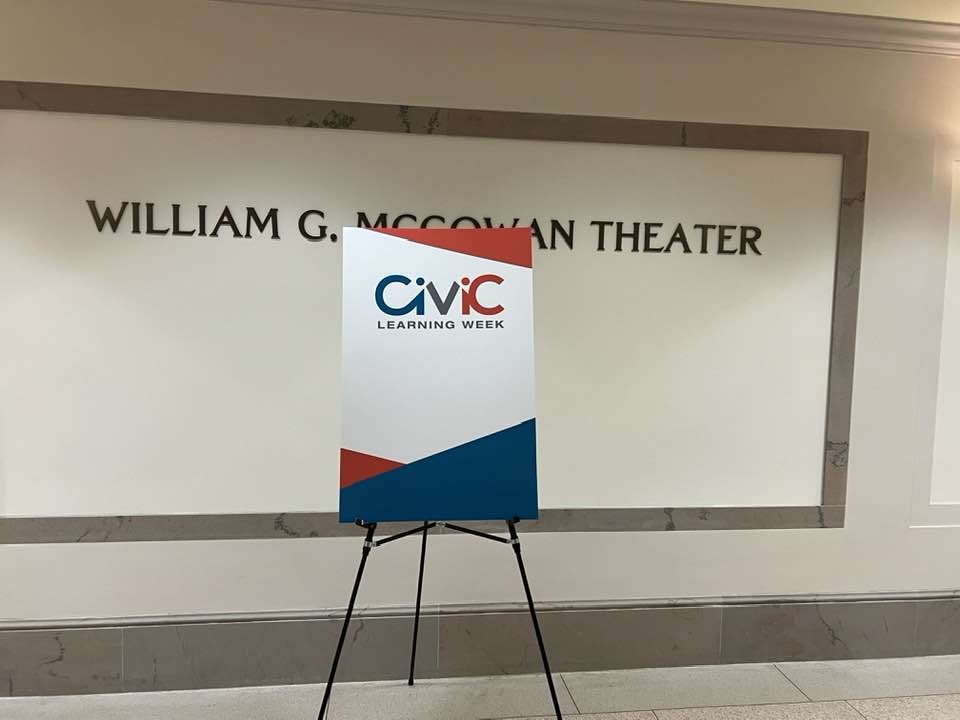 Sign for Civic Learning Week displayed in a hallway near the William G. McGowan Theater