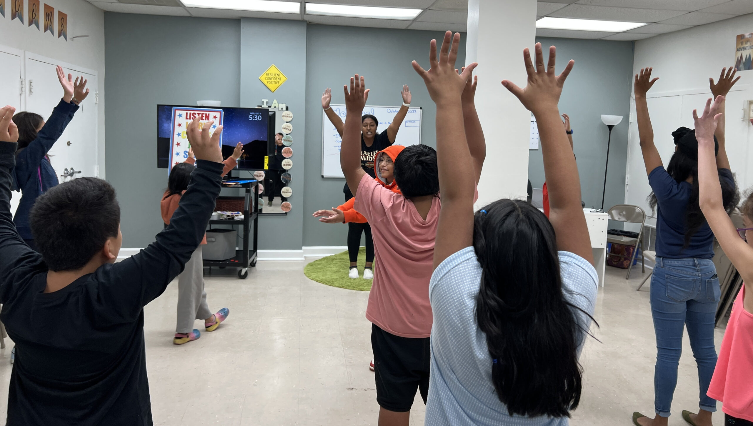 Marissa Barnwell leading children in song and dance