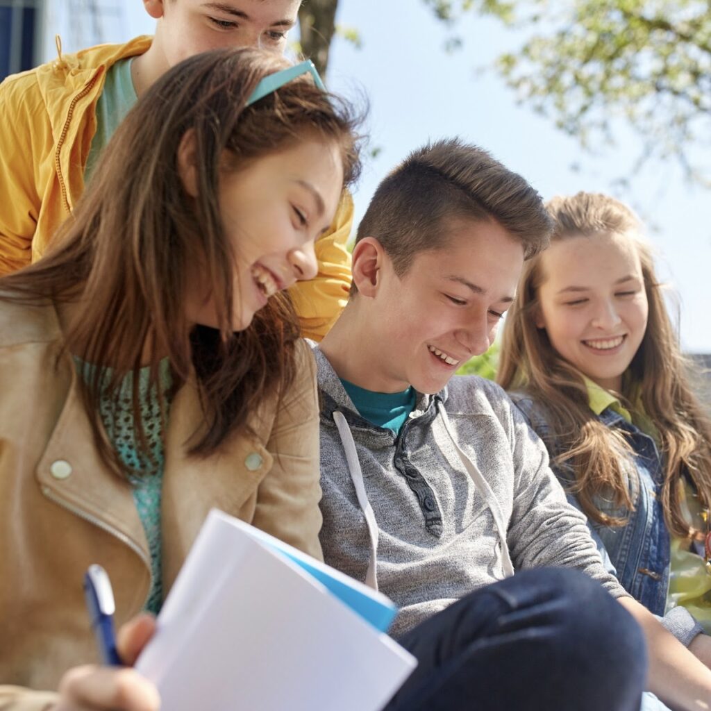 Teens collaborating outside